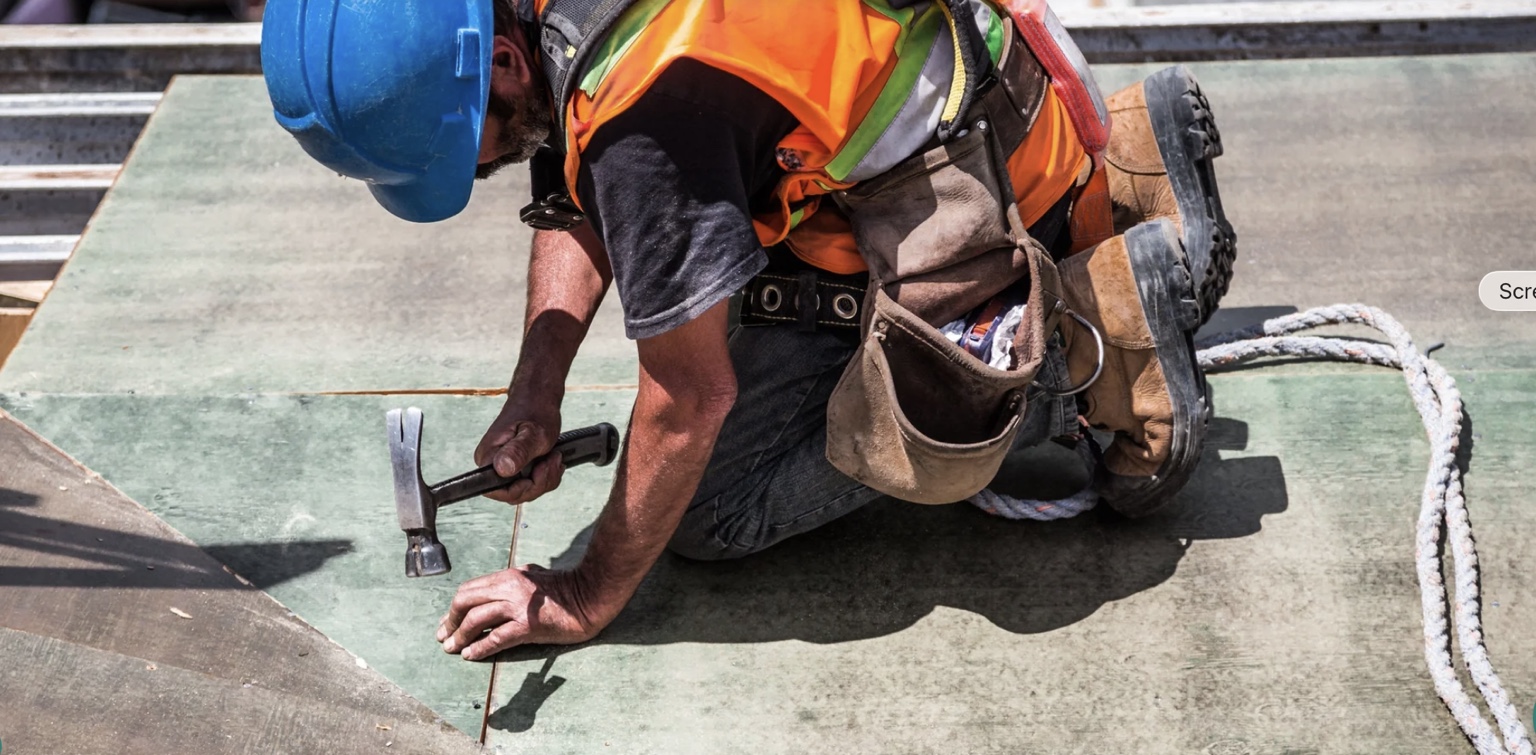 Roofing contractor working