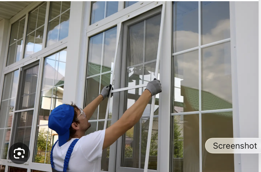 Contractor installing replacement window